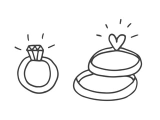 Set of cute hand-drawn doodle elements about love. Message stickers for apps. Icons for Valentines Day, romantic events and wedding. Gold rings with a diamond and a heart.
