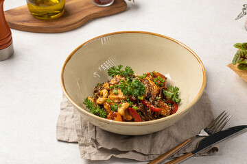 Portion of gourmet thai soba noodles with chicken and cashews