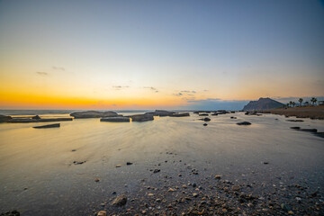 Beautiful seascape at sunset with rock formations in the water