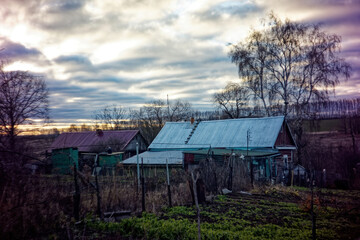 old wooden country house in early spring