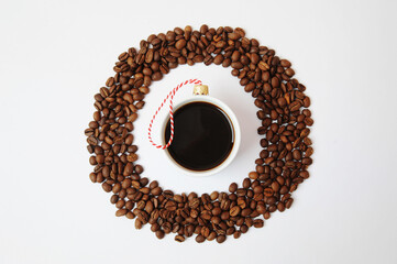 Christmas New Year coffee concept. Cup of black espresso coffee decorated as christmas tree ball. In round frame made of cofee beans. On white background