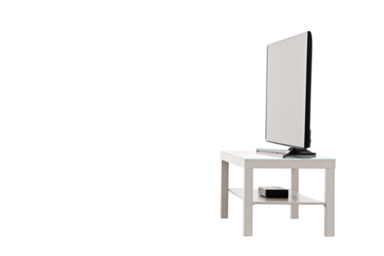 Side view shot of a flat screen TV on a white shelf