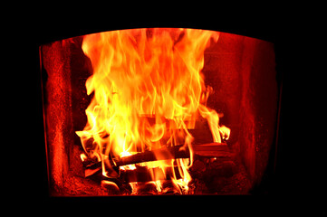 The wood burns in the fireplace, bringing warmth to autumn