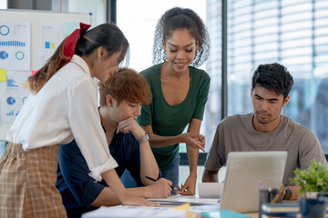 Creative young Asian businesspeople meeting to exchange ideas from each department to drive new projects at the meeting.