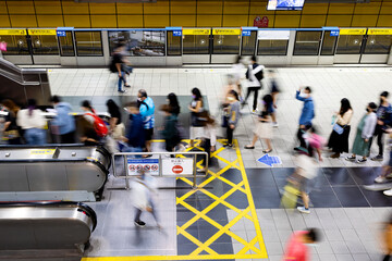 TAIPEI,TAIWAN - JUNE 14 2022: Passengers waiting and ride the MRT, on June 14,2022 in Taipei. The...