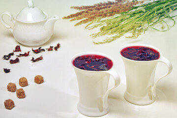 Herbal tea from Sudanese rose hibiscus flowers and mint in elega