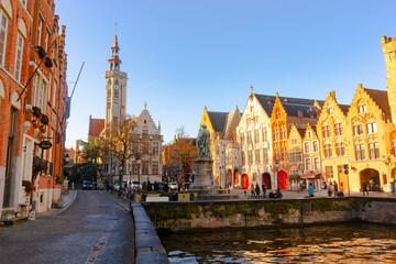 Jan Van Eyck Square ,  located along the canals of Academiestraat, Spiegelrei and Spanjaardstraat in Brugge during winter sunny day : Brugge , Belgium : November 30 , 2019
