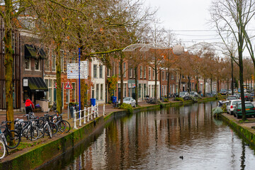 Old town of Delft , Canal city  and bridges with classic buildings since medieval : Delft , Netherlands : November 28 , 2019
