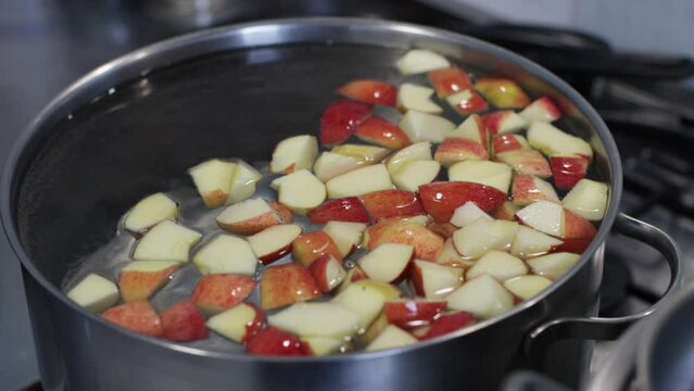 Cookng process. Drink from boiled apples. Traditional Ukrainian beverage compote