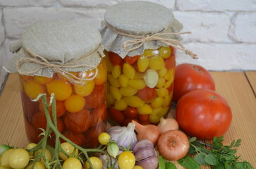 Red and yellow tomatoes in a jar