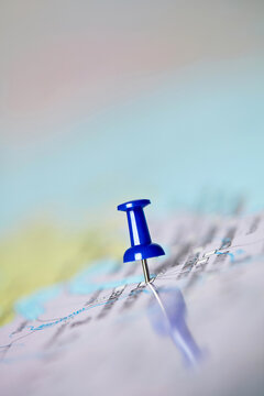 Close-up Of Blue Pushpin On A Map