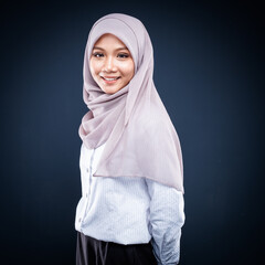 Portrait of Muslim woman in office attire and wearing a hijab. Asian woman in a corporate world. Formal corporate outfit and elegant appearance. Corporate or business people concept. Isolated