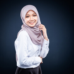 Portrait of Muslim woman in office attire and wearing a hijab. Asian woman in a corporate world. Formal corporate outfit and elegant appearance. Corporate or business people concept. Isolated