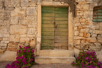 Old wooden door in a stone wall
