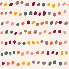 Seamless pattern with colorful dots on the beige background. Confetti Background. Modern abstract pattern with polka dots. For the design of textiles, wrapping paper, wallpaper.