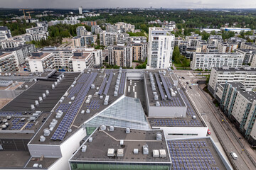 Solar panels on the roof of a shopping mall building