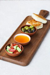Traditional Turkish breakfast plate. Salad, tomatoes, olives and pastry (Su böreği).