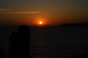 Fototapeta premium mystical sunset by the sea with a section of coast 