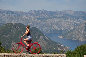 woman riding a bicycle in the mountains