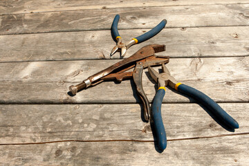 flat lay of wrenches on weathered deck floor