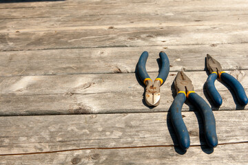 flat lay of wrenches on weathered deck floor