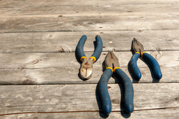 flat lay of wrenches on weathered deck floor