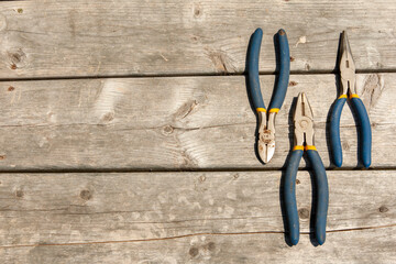 flat lay of wrenches on weathered deck floor