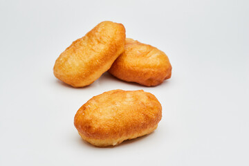 Tasty fried donuts isolated on white background. Unhealthy food. Studio shoot