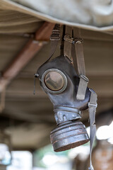 World War II gas mask hanging in truck