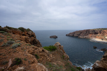 Coastal landscape with sea, rocks, beaches and horizon
