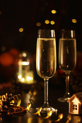 Two glasses with champagne in New Year Eve and Christmas style