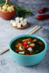A bowl with miso soup, traditional Japanese dish	