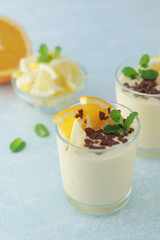 Orange lemon citrus milk mousse in glasses	