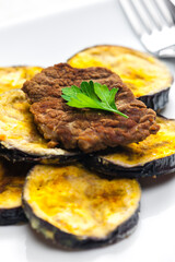 meat in breadcrumbs with grilled aubergine