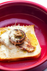 slice of  toast bread grilled with meat, champignon and cheese