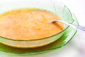 still life of vegetables consomme with carrot