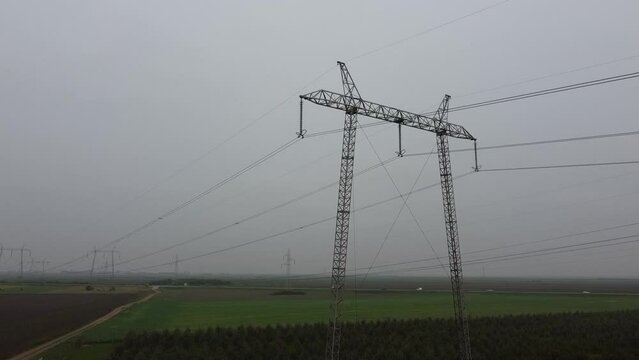 Drone footage of power lines in the field
