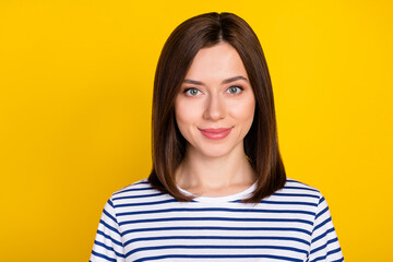Portrait of young nice gorgeous girl with brunette hairstyle wear striped t-shirt smiling at camera isolated on yellow color background