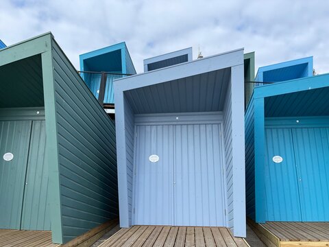 Beach huts on the seafront painted bright colours. Taken in Lowestoft England. 