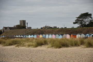 Beach huts on the seafront painted bright colours. Taken in Lowestoft England. 