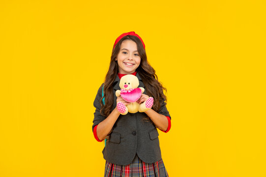 happy child with toy. cute teen girl with toy bear. back to school. knowledge day.