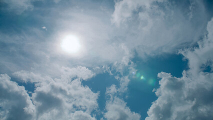 Bright sun's rays floating in a deep sea of clouds, beautiful sunny pastel unfolding across the sky. Amazing loveliness of nature scenery, warm of summer sunrise