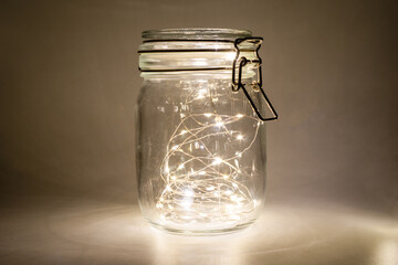 Fairy lights in a glass jar, Isolated on a dark background,easter day concept