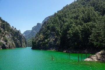 View of the lake with green water and on the mountain cliffs of the Green Canyon. Landscape of Green canyon, Manavgat, Antalya, Turkey