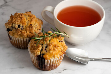 Blueberry Crumble Muffins on the marble floor