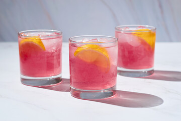 Fototapeta na wymiar Alcoholic cocktail negroni with ice and lemon slice.