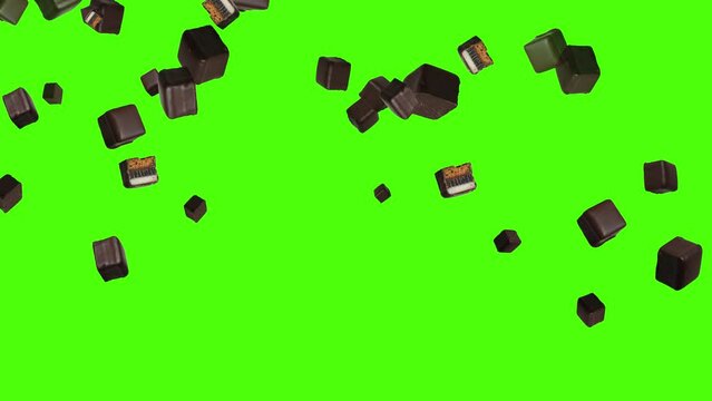 Isolated chocolates fall down in front of green screen. Chocolate dominoes for Christmas background.  23,98 fps