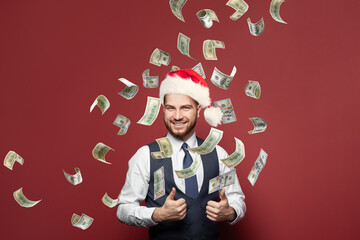 Christmas successful businessman enjoying a rain of money. Business opportunities and success concept