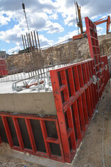 Fototapeta na wymiar Clamped formwork panels at foundation construction