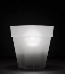 concept energy cuts, DIY lamp, pot and candle indoors, on the desk, background black and white.
